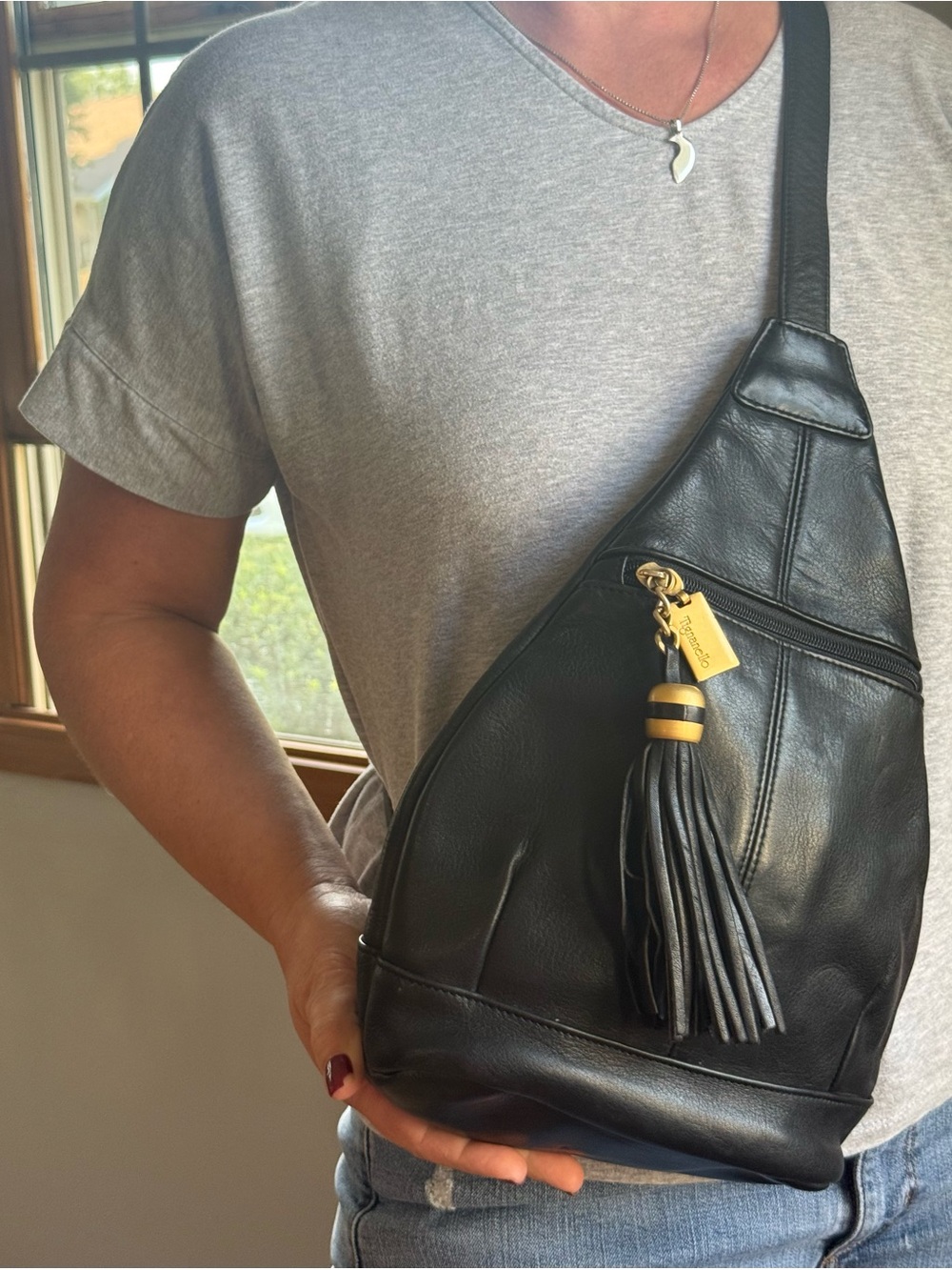 Tignanello Leather Sling Crossbody Bag with Tassel Accent - Black